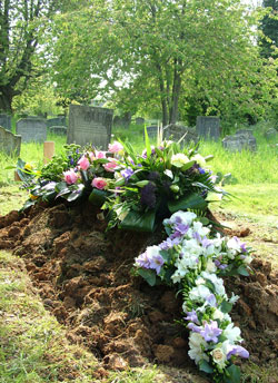 flowers on a grave at All Saints Warlingham